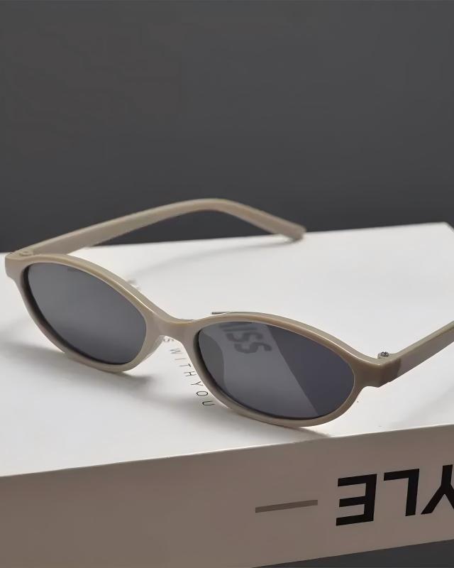 Lifestyle styling view of Retro Oval Slim Sunglasses
