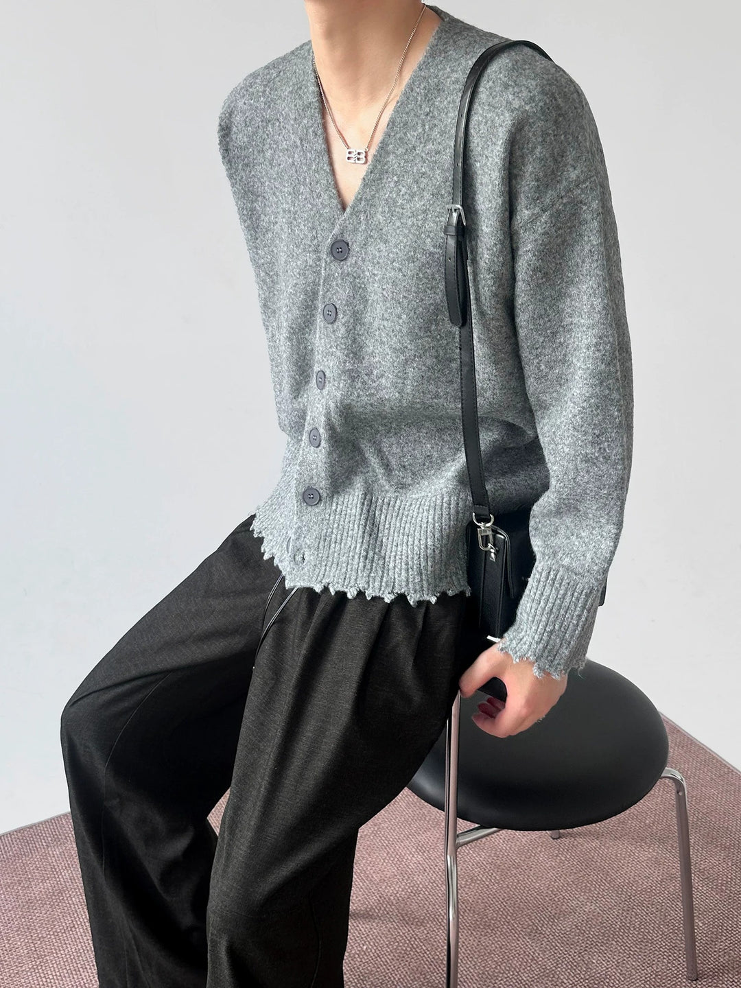 Close-up detail of Distressed V-Neck Knit Cardigan