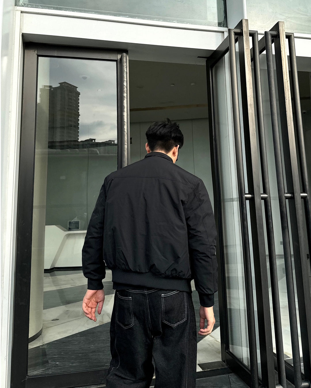 Lifestyle styling view of Minimalist Stand Collar Oversized Bomber Jacket