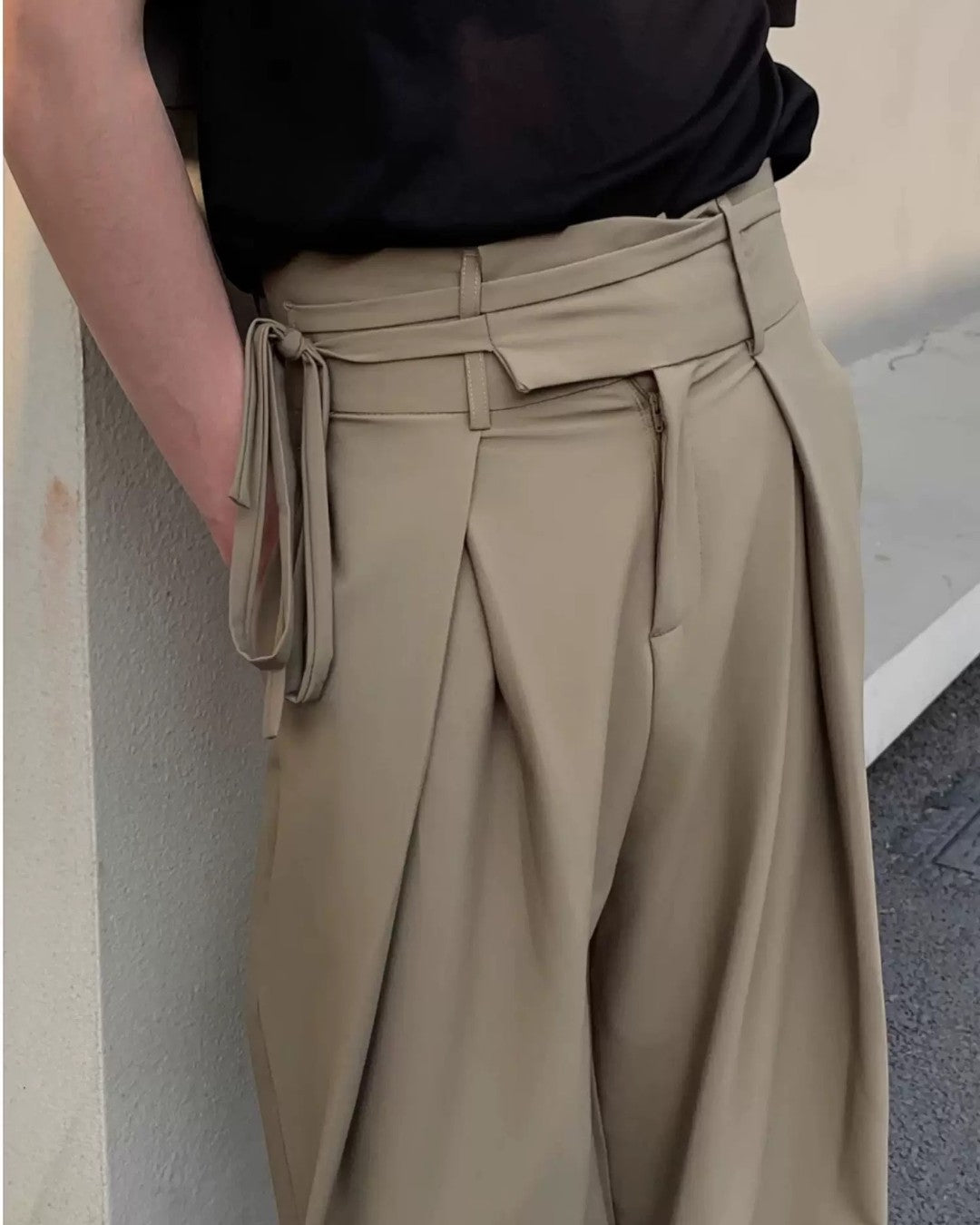 Lifestyle styling view of Pleated Wide Leg Trousers
