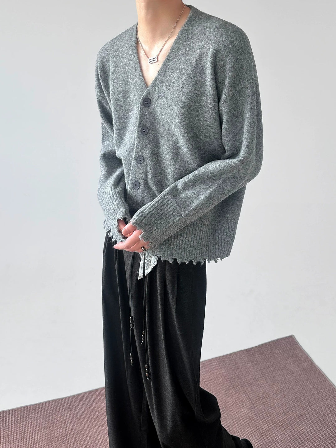 Lifestyle styling view of Distressed V-Neck Knit Cardigan