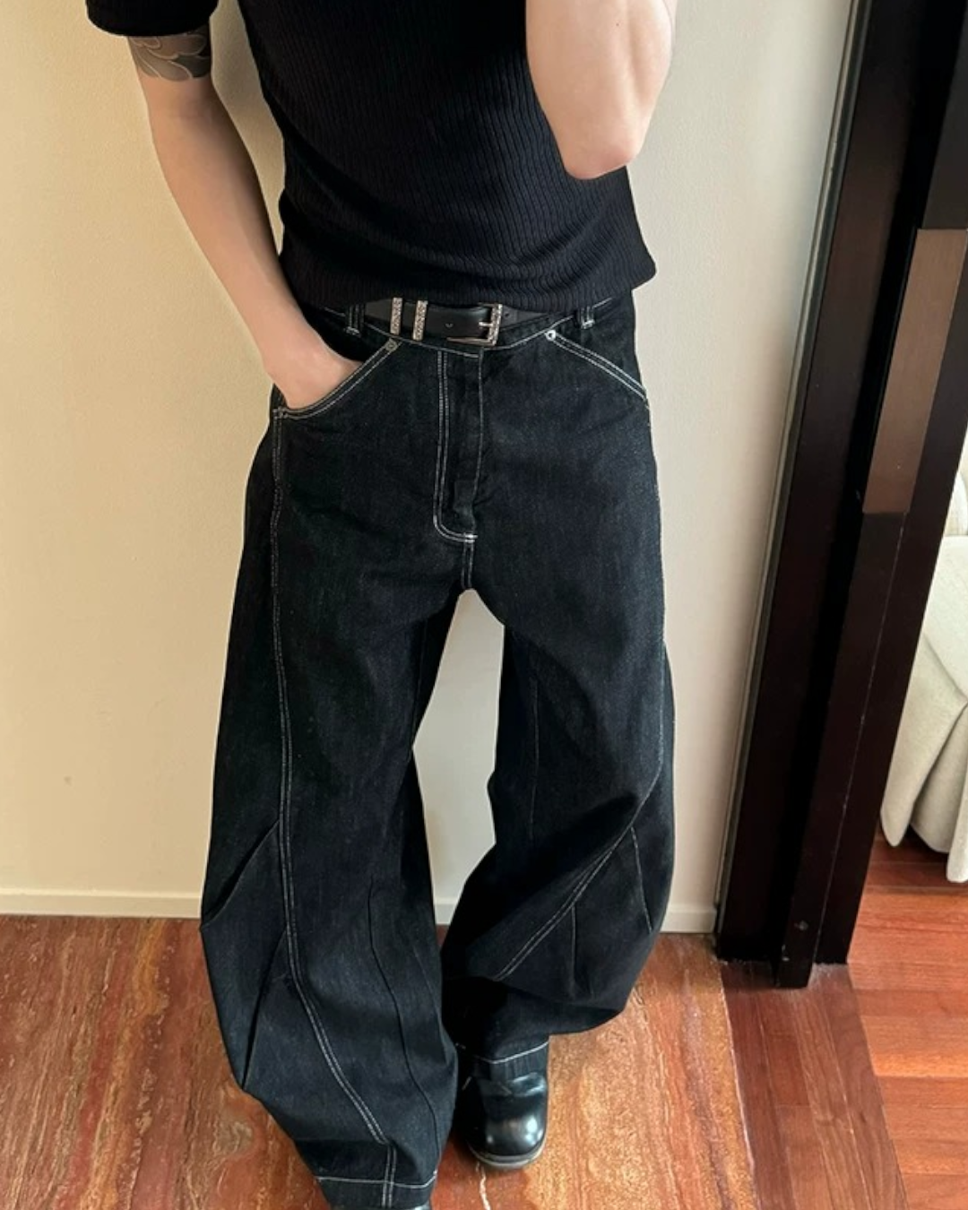 Close-up detail of Minimalist Black Wide Leg Jeans