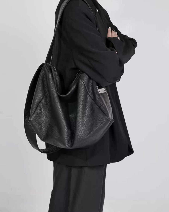 Lifestyle styling view of Oversized Black Leather-Look Crossbody and Shoulder Bag