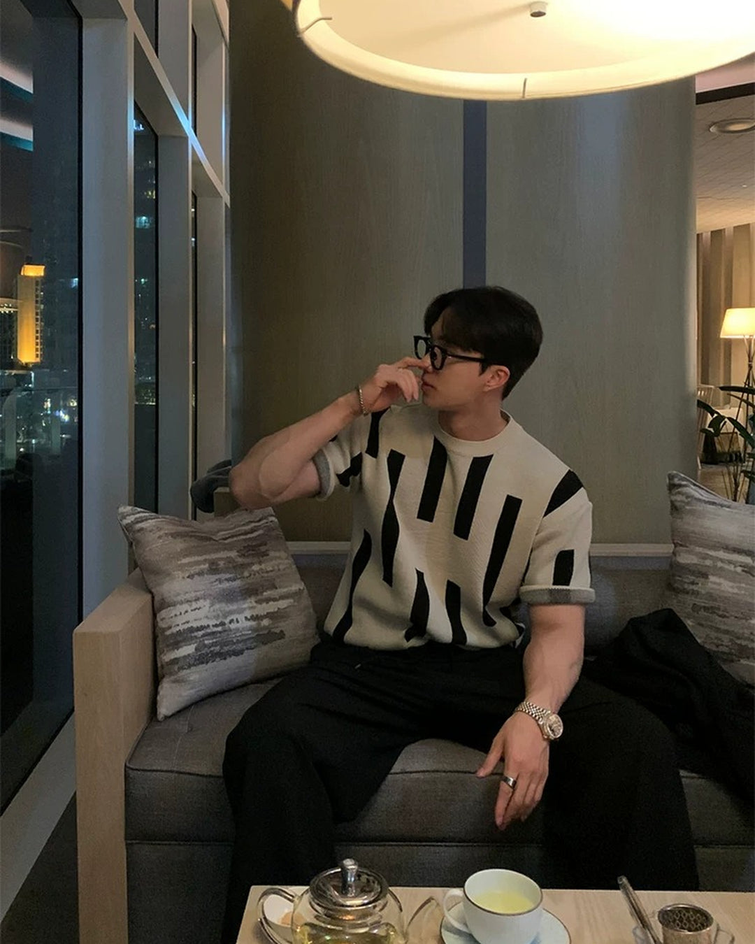 Lifestyle styling view of Beige and Black Striped Knit Oversized T-Shirt