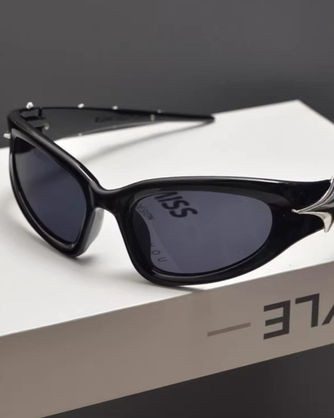 Lifestyle styling view of Slim Oval Y2K Sunglasses