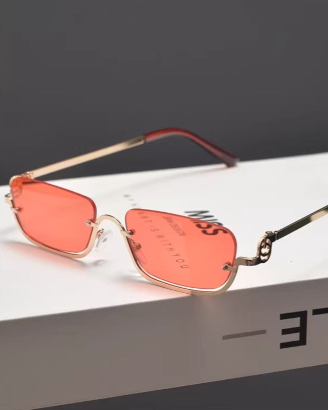 Lifestyle styling view of Slim Square Tinted Sunglasses