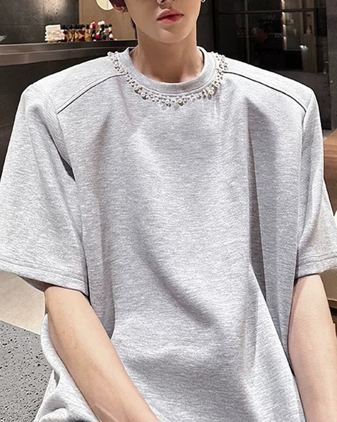 Lifestyle styling view of Oversized T-Shirt with Chain Neck Detail