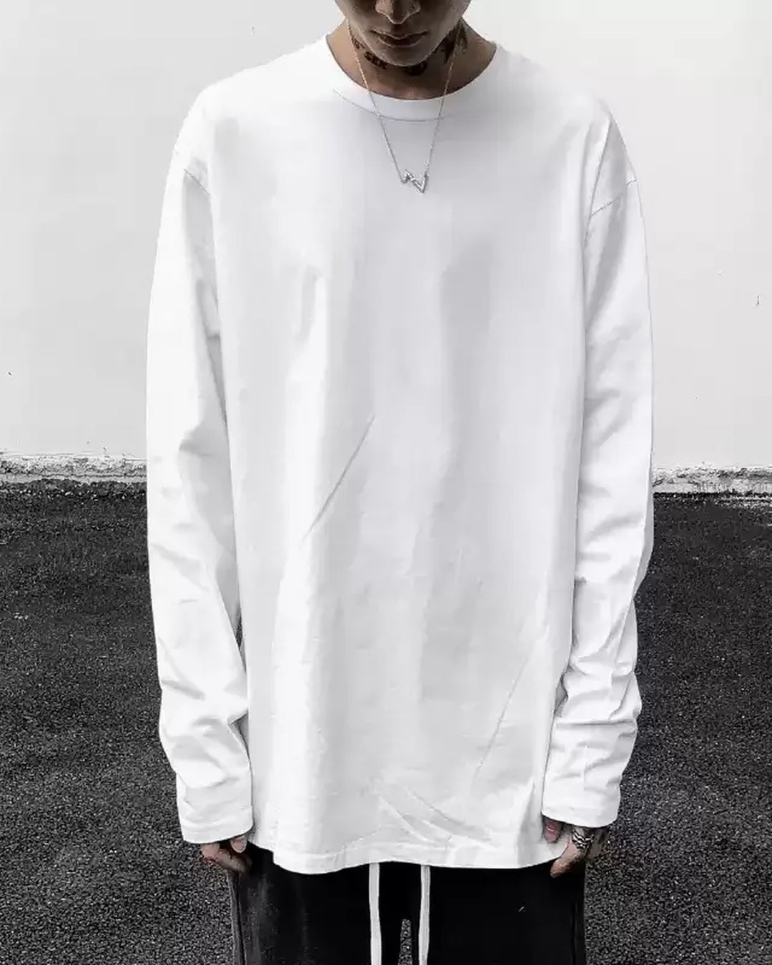Lifestyle styling view of Raw Edge V-Neck Long Sleeve Base Layer