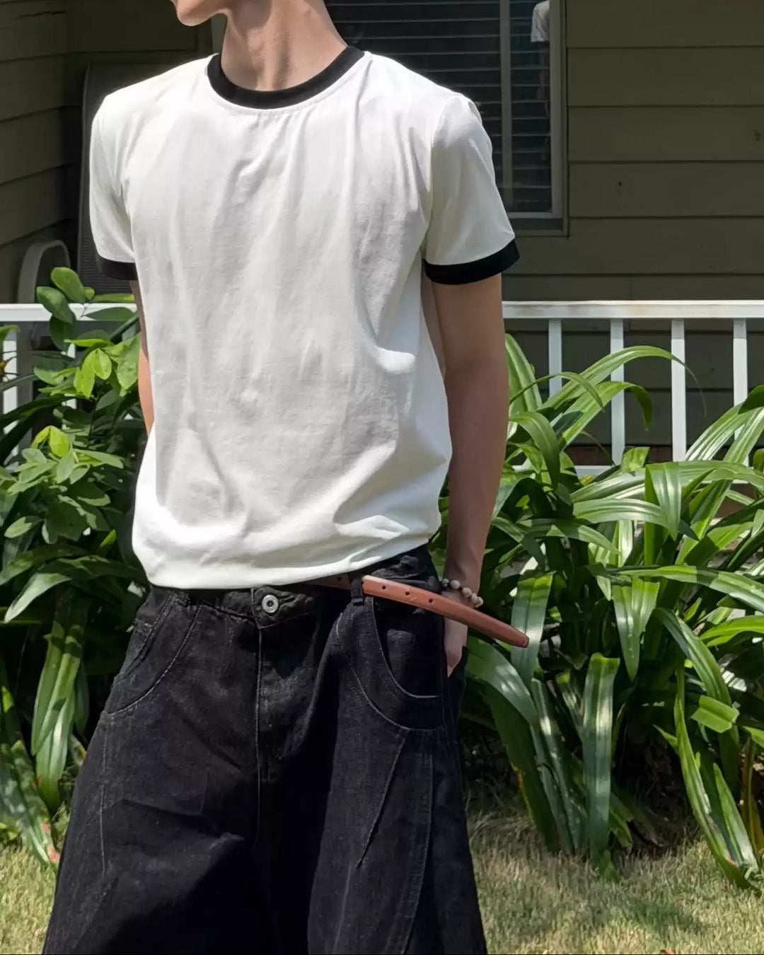 Close-up detail of Black Trim White Oversized T-Shirt