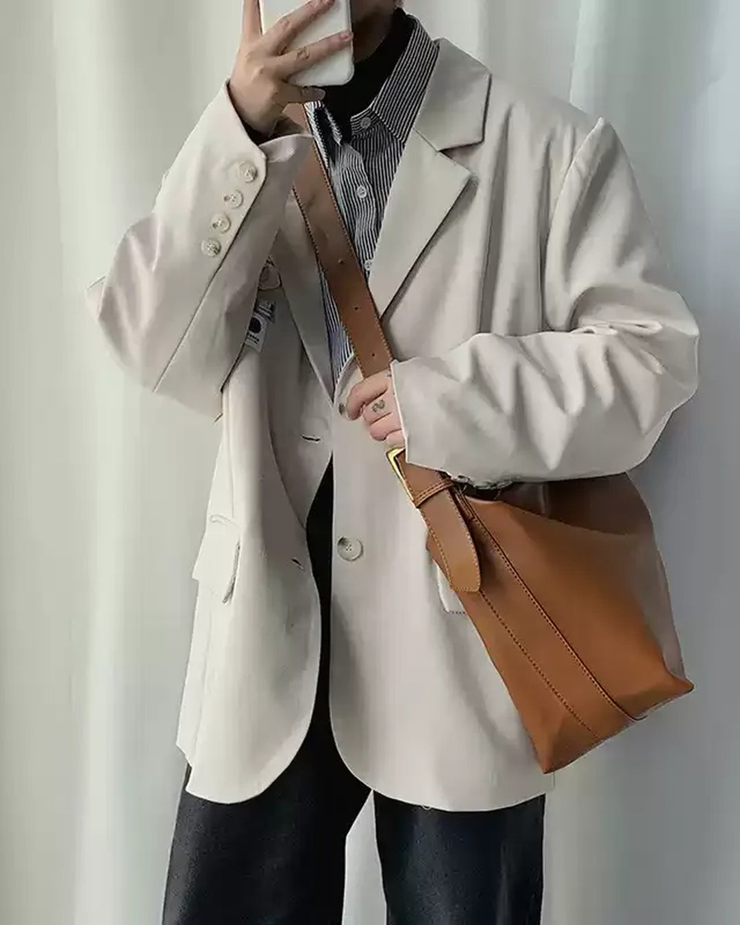 Lifestyle styling view of Oversized Tan Leather-Look Crossbody and Shoulder Bag