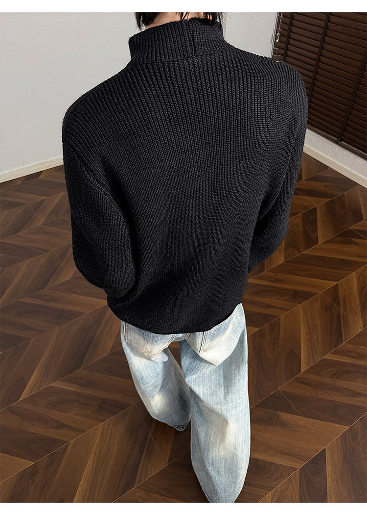 Asymmetric-button knit sweater, back view of the black sweater