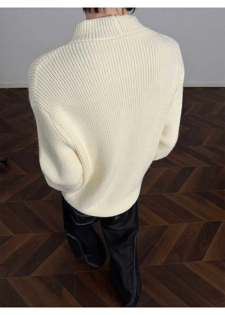 Asymmetric-button knit sweater, back view of the cream sweater