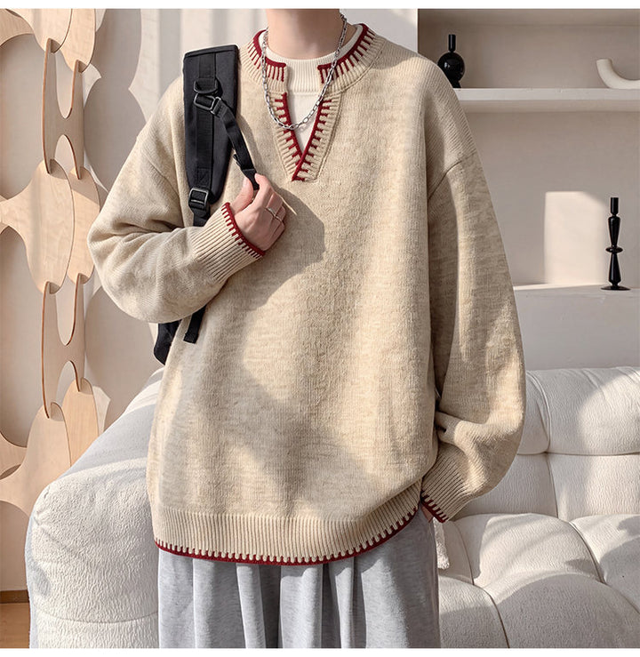 Contrast-trim V-neck sweater, angled view of the cream V-neck