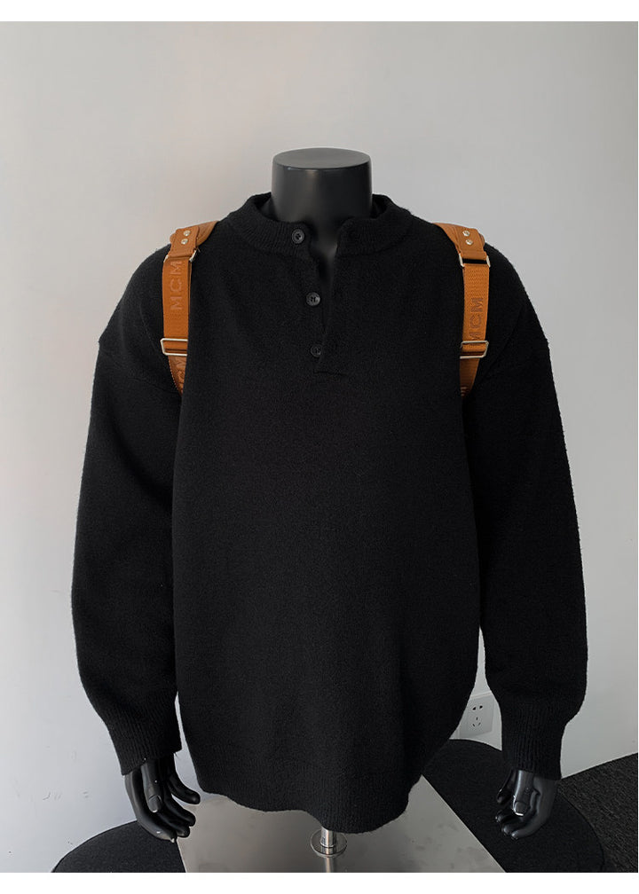 Stand-collar button knit sweater, front view of the black stand-collar sweater