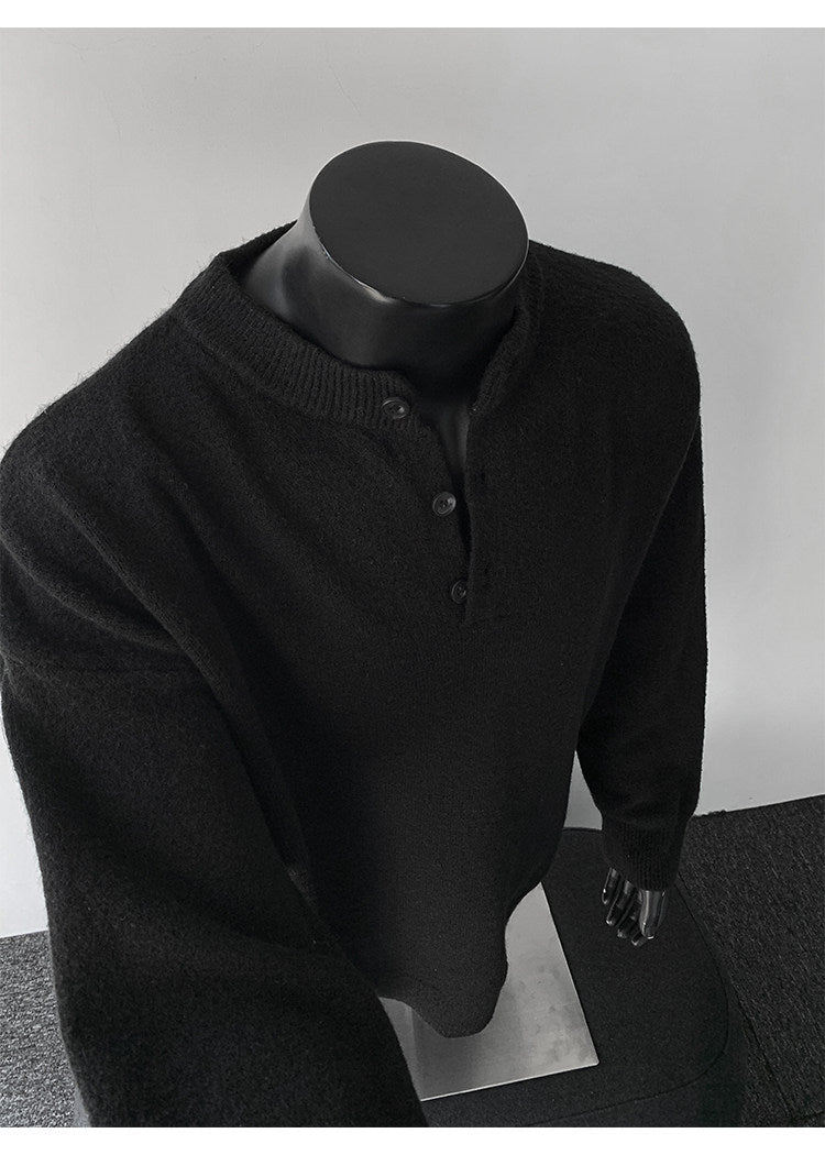 Stand-collar button knit sweater, angled view of the black sweater