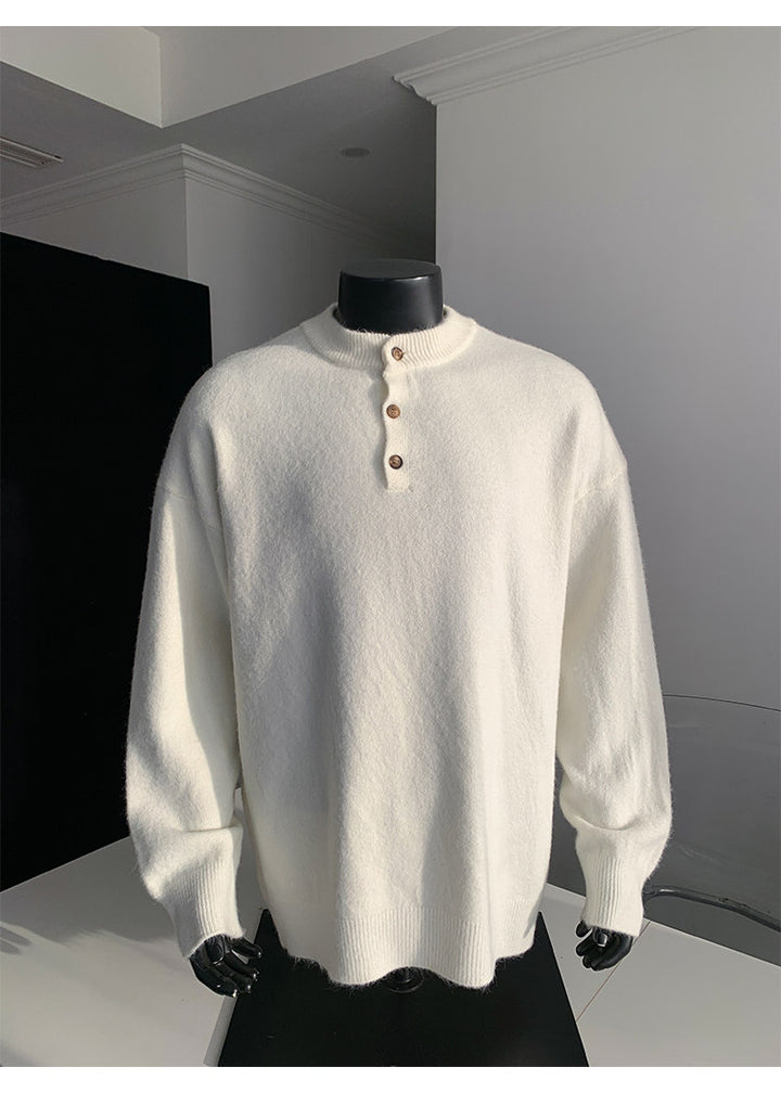 Stand-collar button knit sweater, angled view of the cream sweater