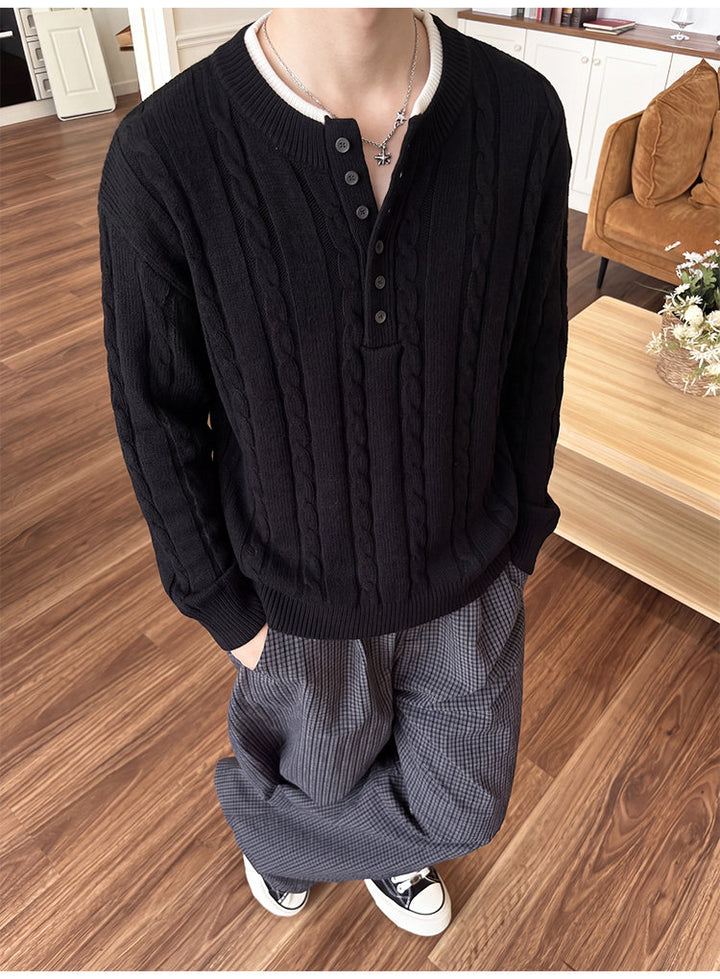 Layered henley knit sweater, front view of the black henley sweater