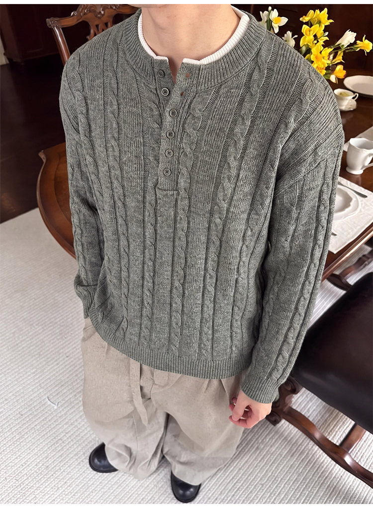 Layered henley knit sweater, close-up view of the gray henley placket