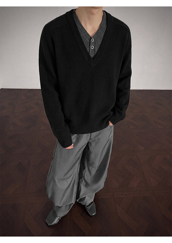 Layered V-neck knit sweater, angled view of the black sweater