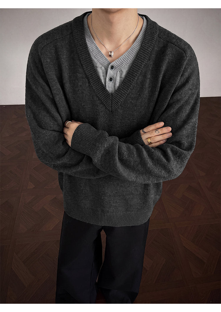 Layered V-neck knit sweater, front view of the charcoal sweater