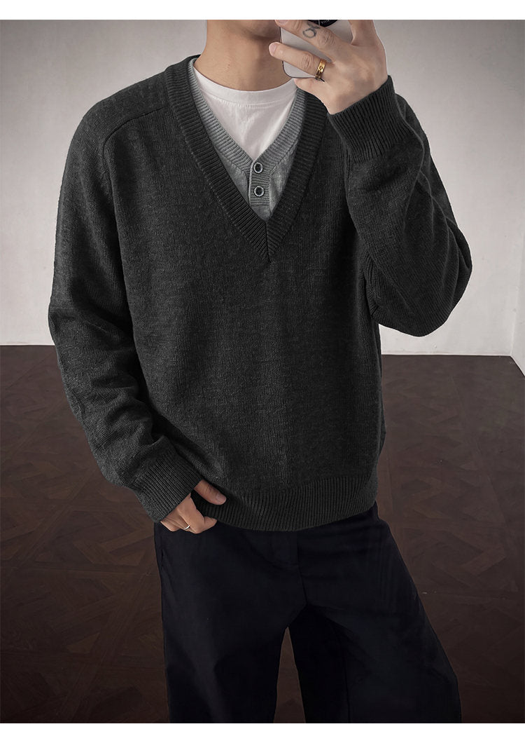 Layered V-neck knit sweater, angled view of the charcoal knit
