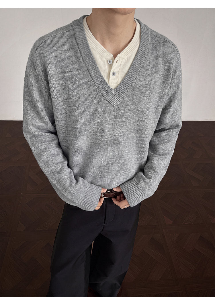 Layered V-neck knit sweater, front view showing the layered neckline