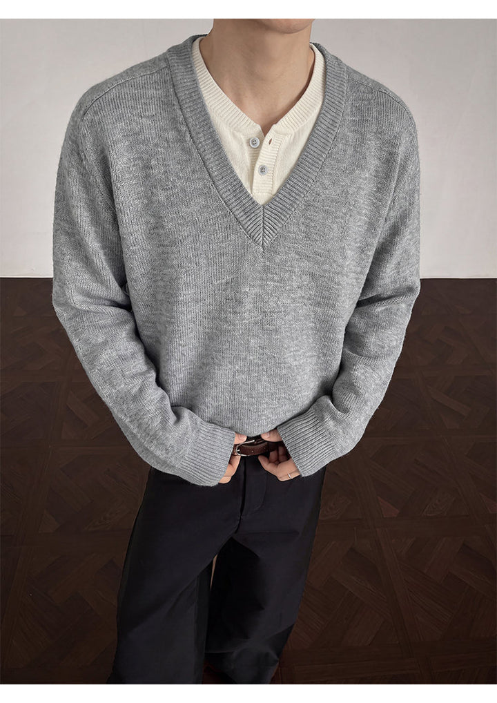 Layered V-neck knit sweater, front view showing the layered neckline
