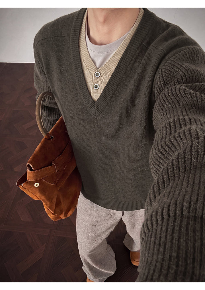 Layered V-neck knit sweater, angled view of the gray knit texture