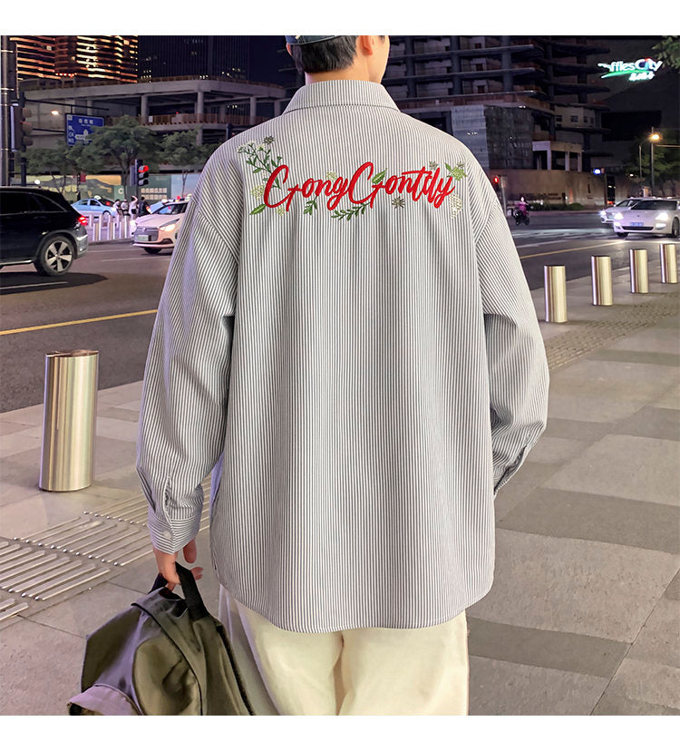 Letter-embroidered shirt, back view showing the full embroidery