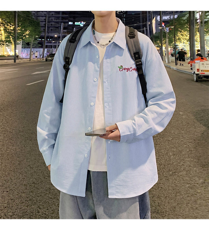 Letter-embroidered shirt, front view with a backpack