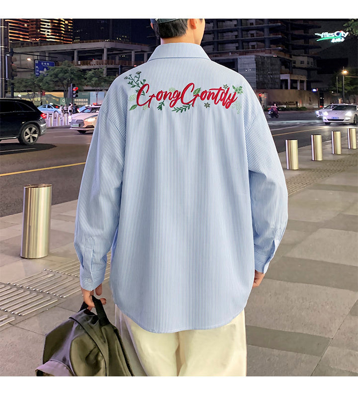 Letter-embroidered shirt, back view showing the large script embroidery