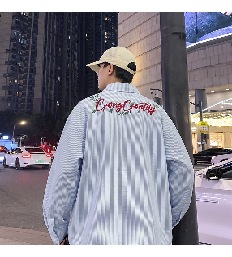Letter-embroidered shirt, back view showing the rear script