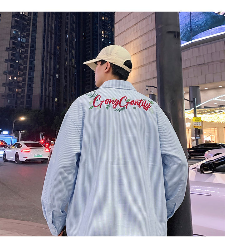 Letter-embroidered shirt, back view showing the rear script