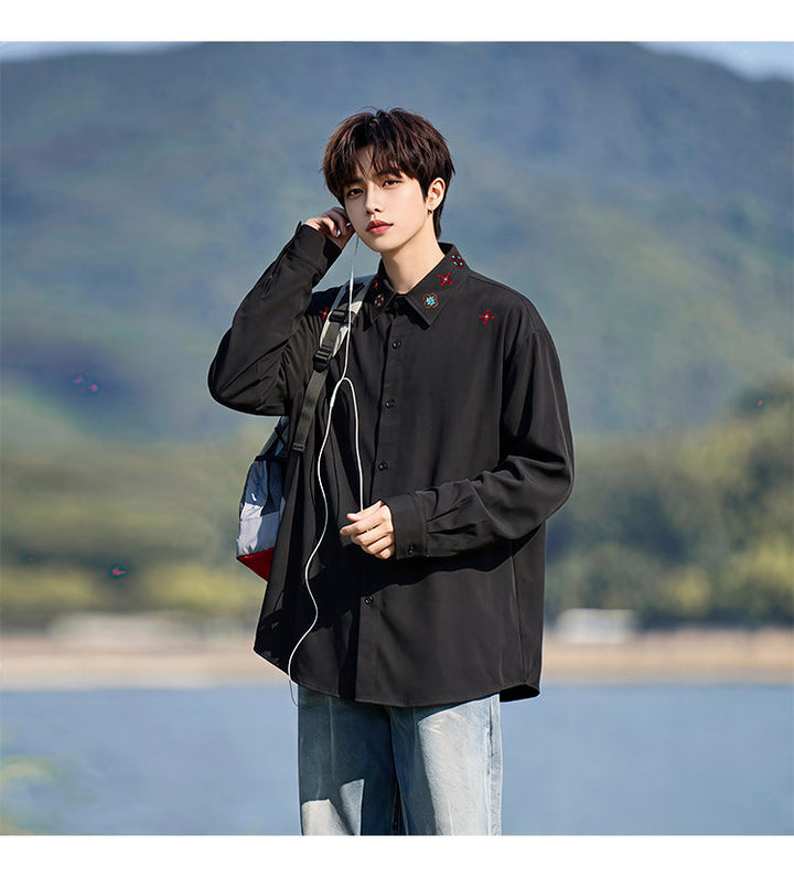 Minimal-embroidered shirt, angled view with a shoulder bag