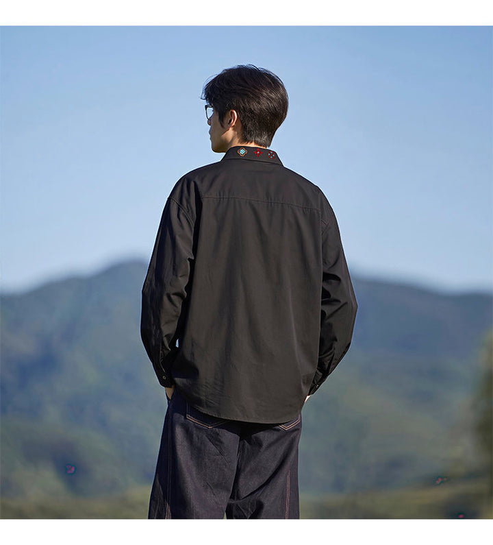 Minimal-embroidered shirt, back view of the black shirt