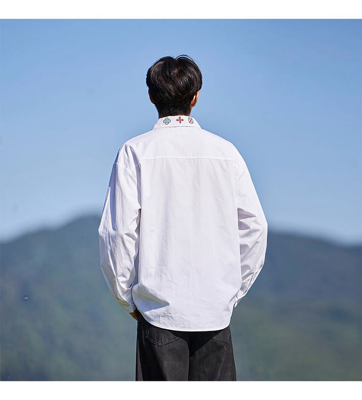 Minimal-embroidered shirt, back view of the white shirt