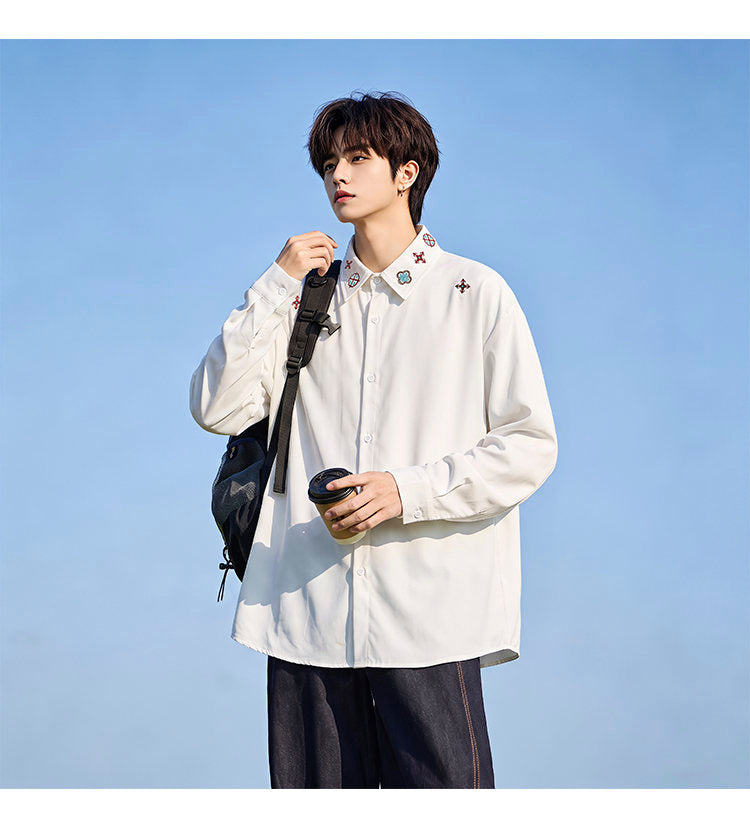 Minimal-embroidered shirt, front view showing the small red motifs