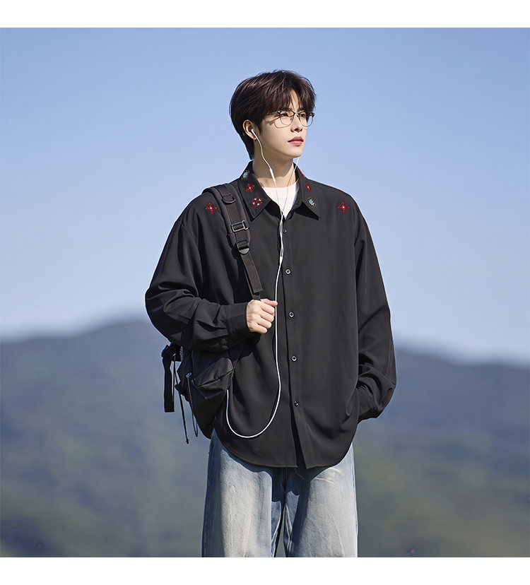 Minimal-embroidered shirt, angled view of the black shirt