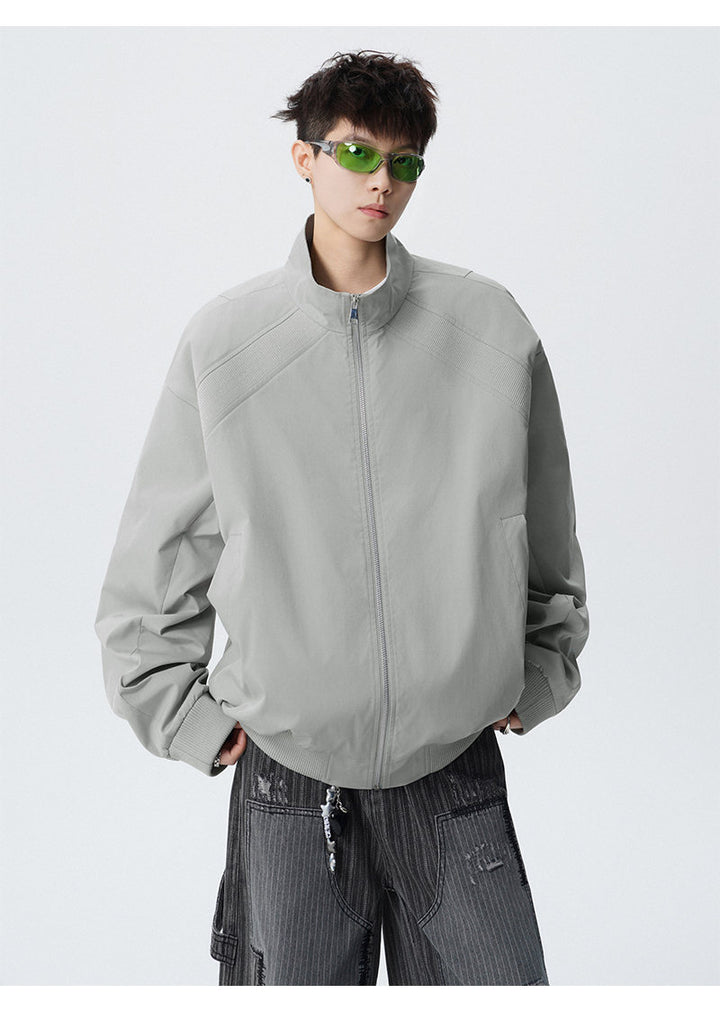 Paneled stand-collar jacket, front view of the gray paneled jacket