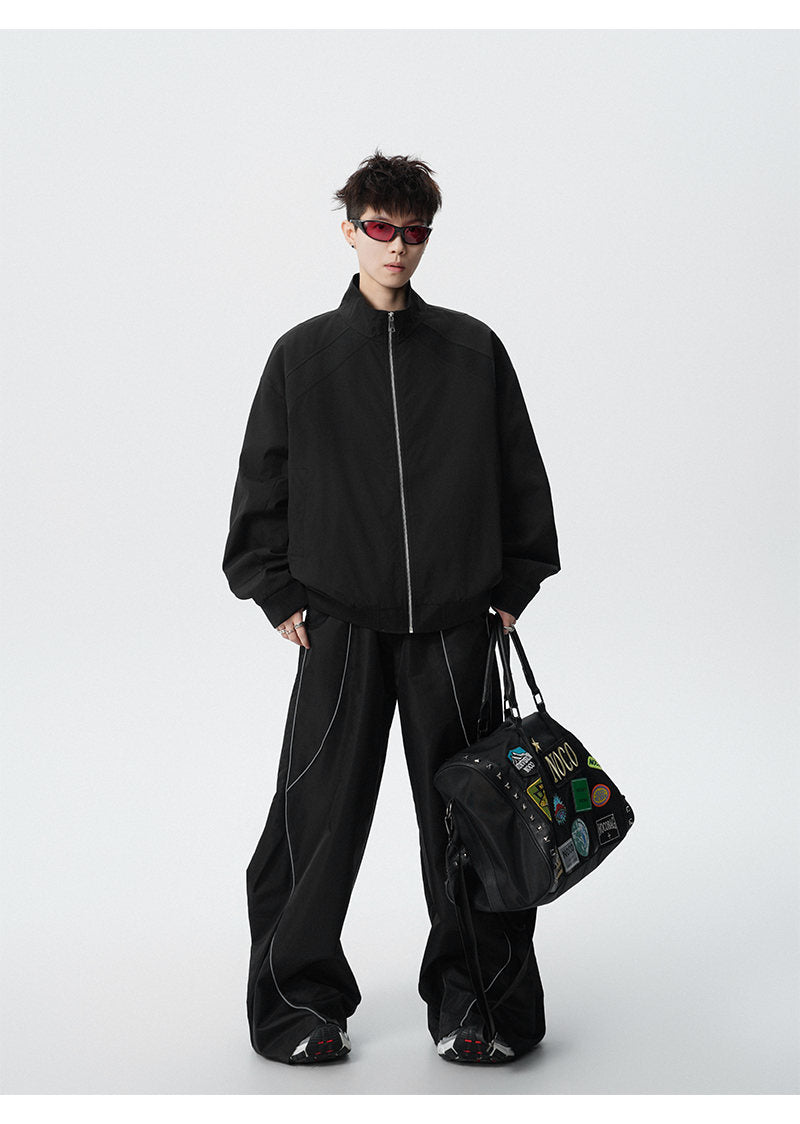 Paneled stand-collar jacket, full-length view of the black jacket