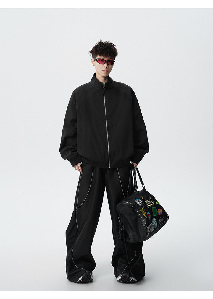 Paneled stand-collar jacket, full-length view of the black jacket