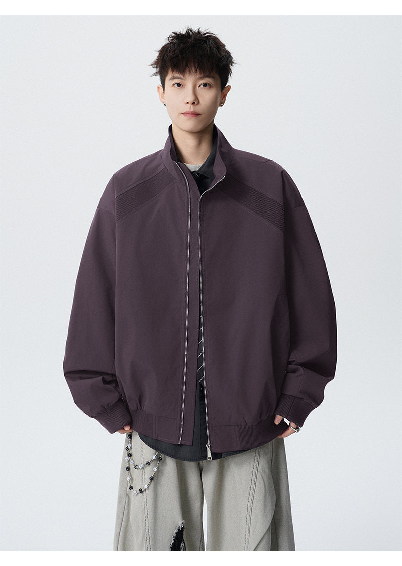 Paneled stand-collar jacket, front view of the purple paneled jacket
