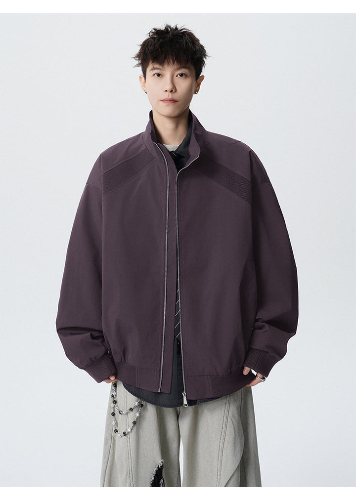 Paneled stand-collar jacket, front view of the purple paneled jacket