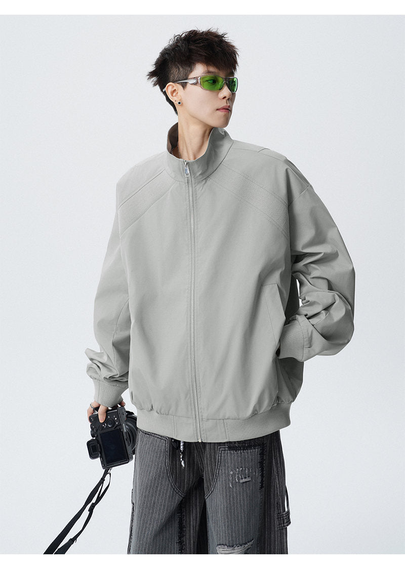 Paneled stand-collar jacket, front view showing the stand collar