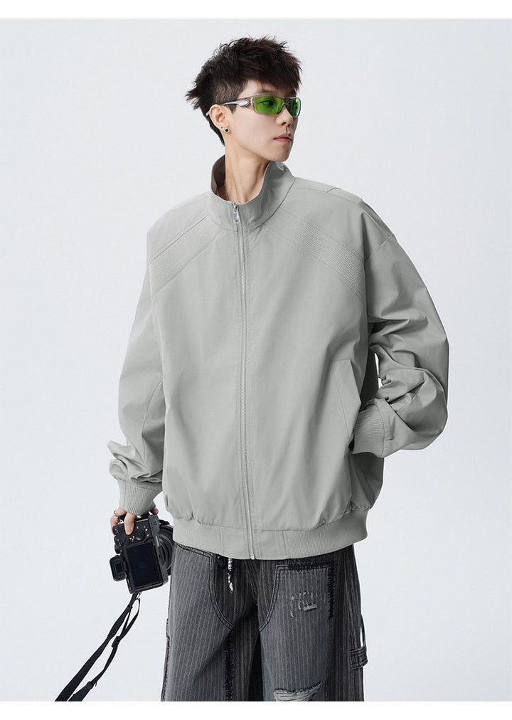 Paneled stand-collar jacket, front view showing the stand collar