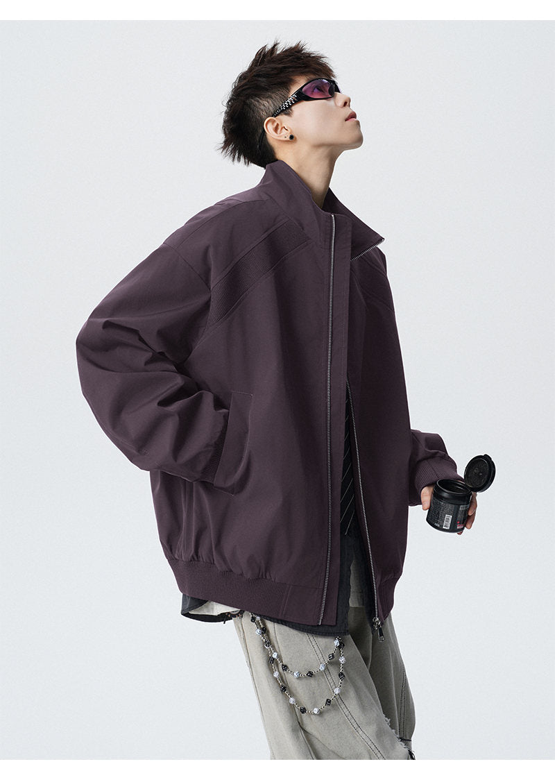 Paneled stand-collar jacket, angled view of the purple jacket