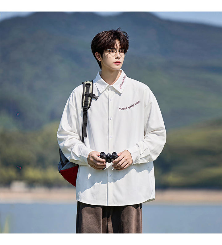 Script-embroidered shirt, front view of the white script-embroidered shirt