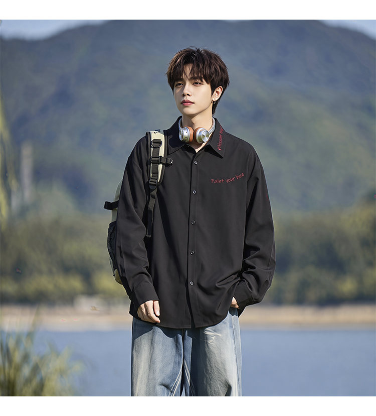 Script-embroidered shirt, styled view of the black shirt