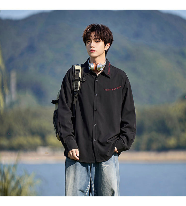 Script-embroidered shirt, styled view of the black shirt