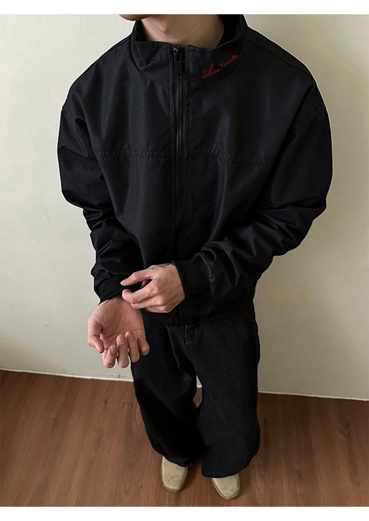 Utility bomber jacket, front view of the black utility bomber